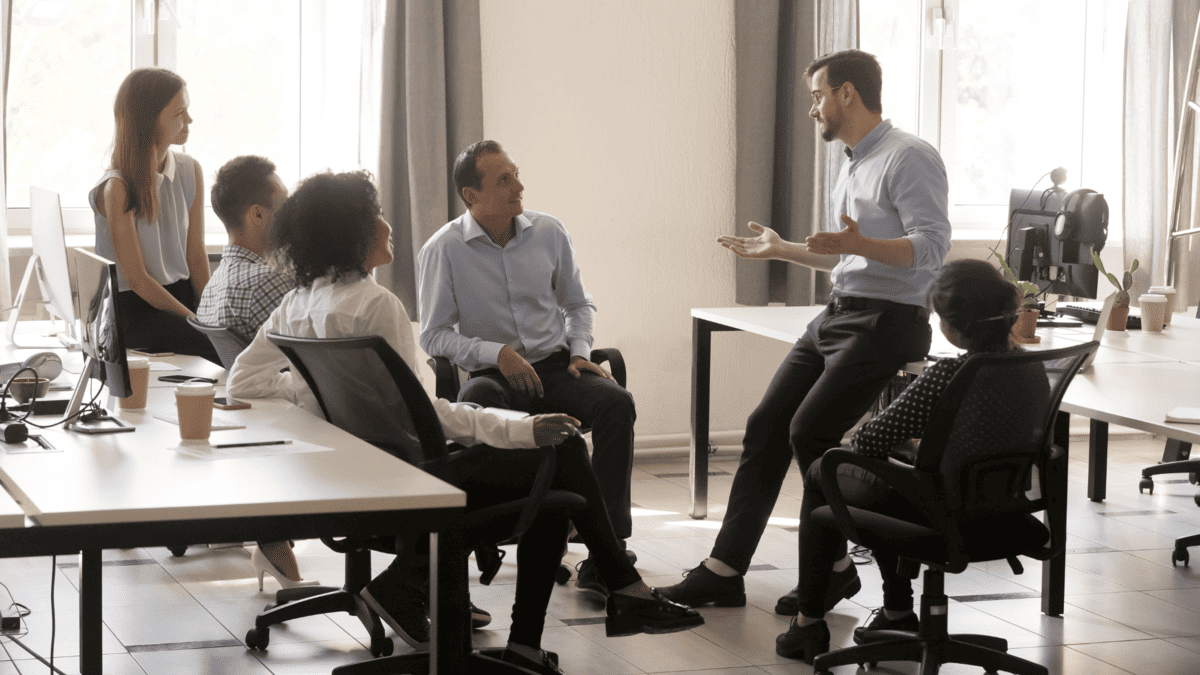 placeholder image of a team listening to their team leader