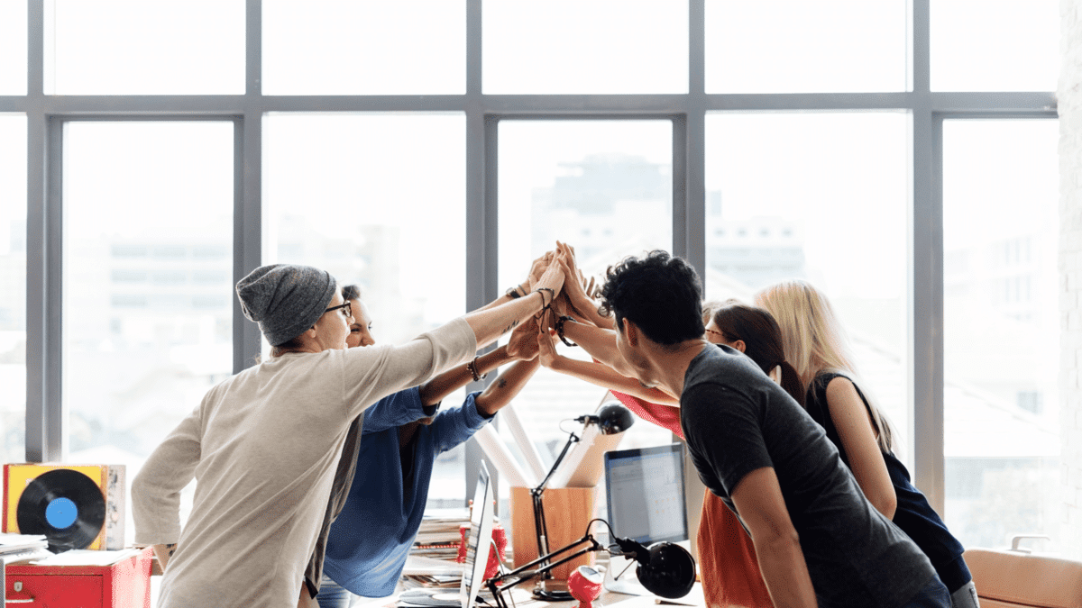 a placeholder image of a team high-fiving